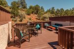 A large private deck has ample seating to relax and BBQ